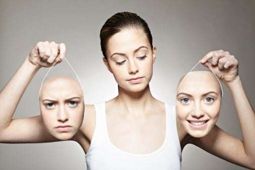 woman holding up two masks