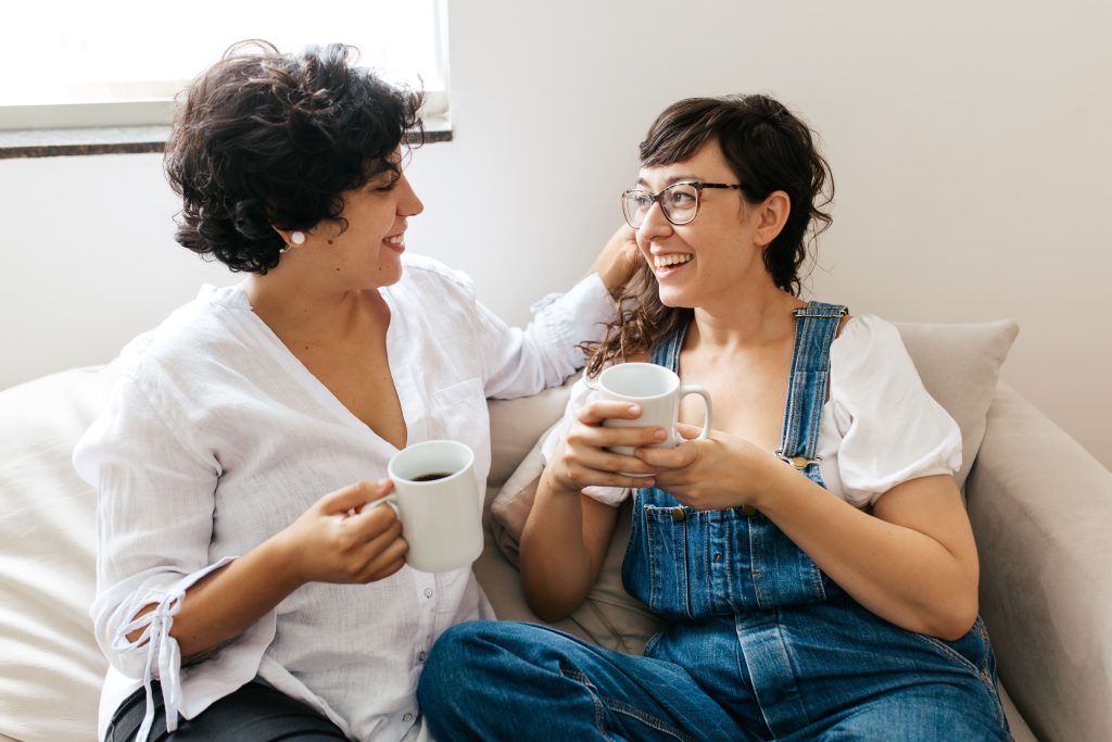two women smiling at each other