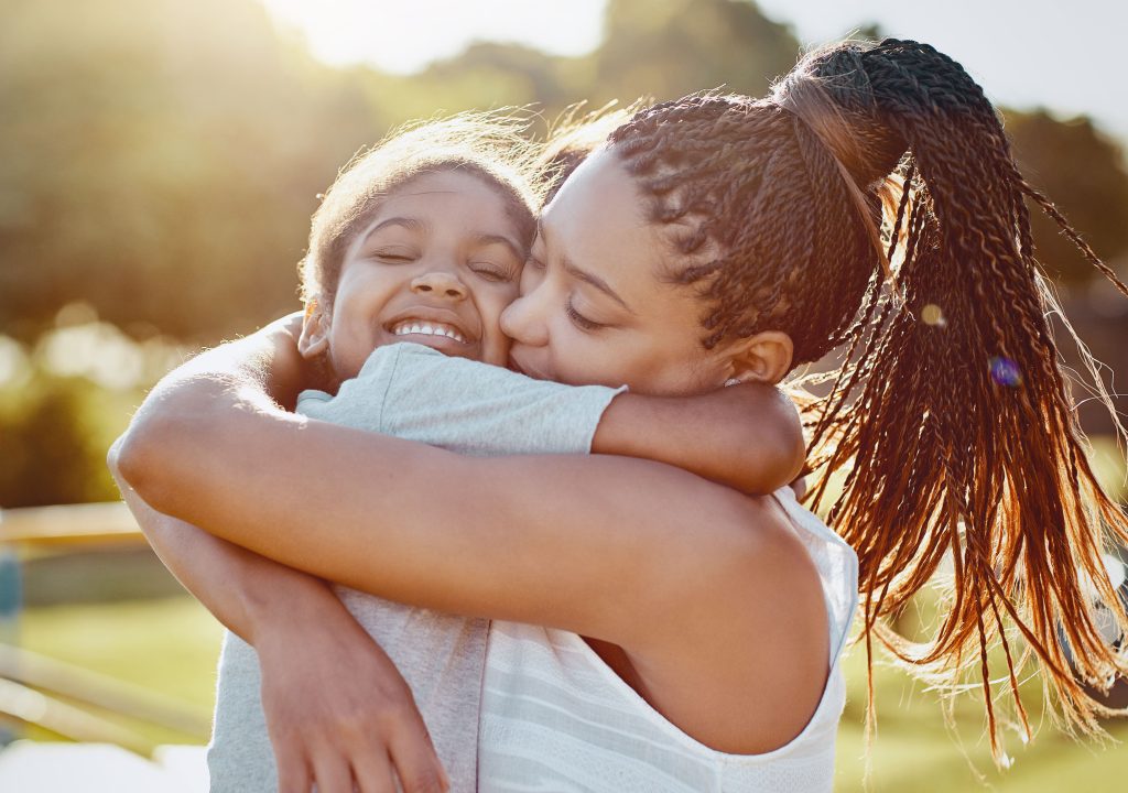 woman and kid hugging